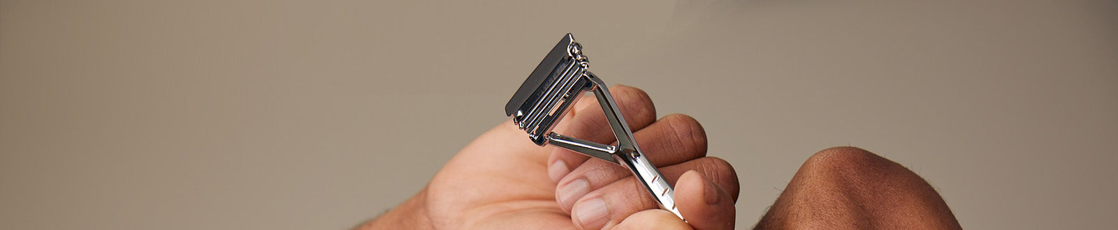 User holding up leaf razor