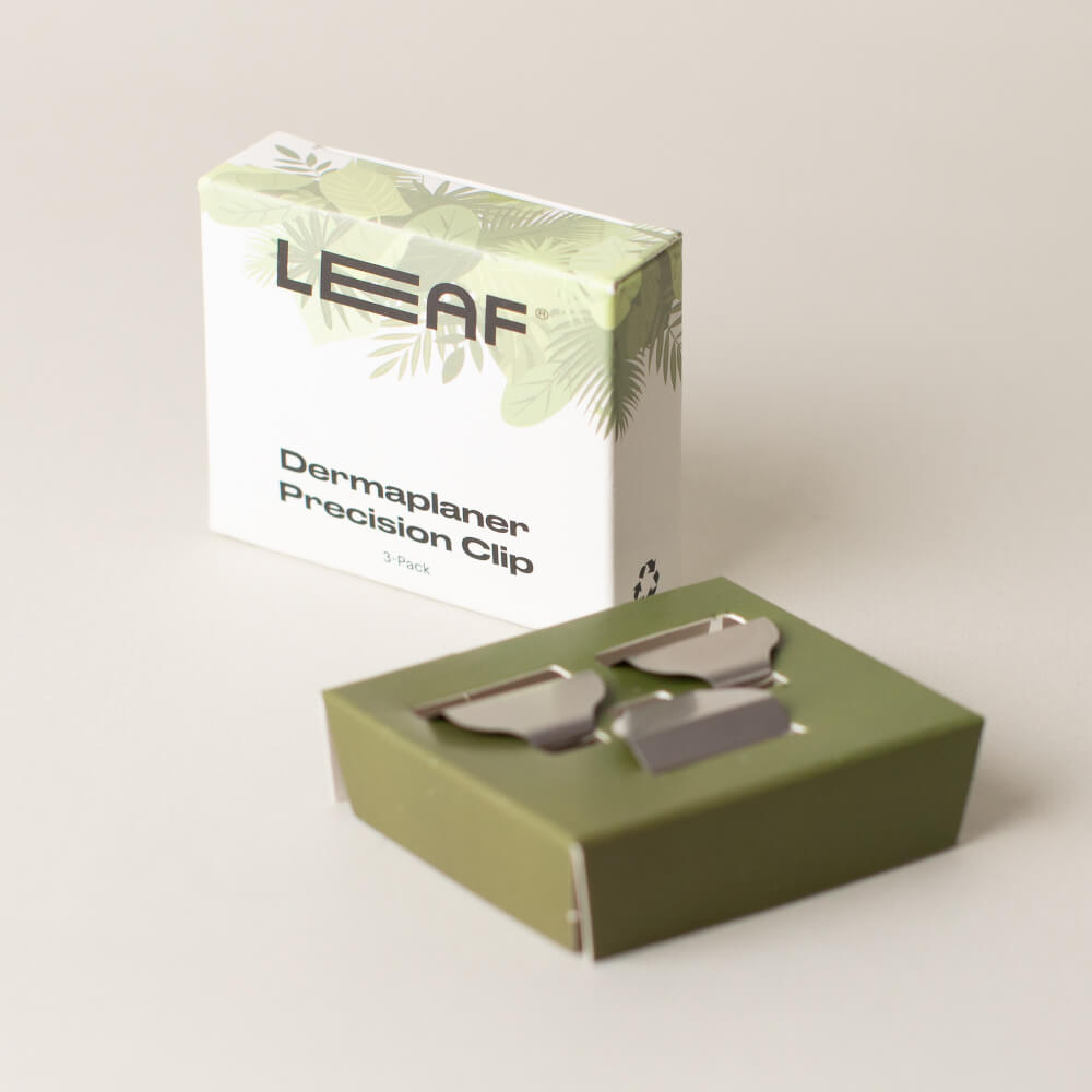 A dermaplaner precision clip pack next to its box