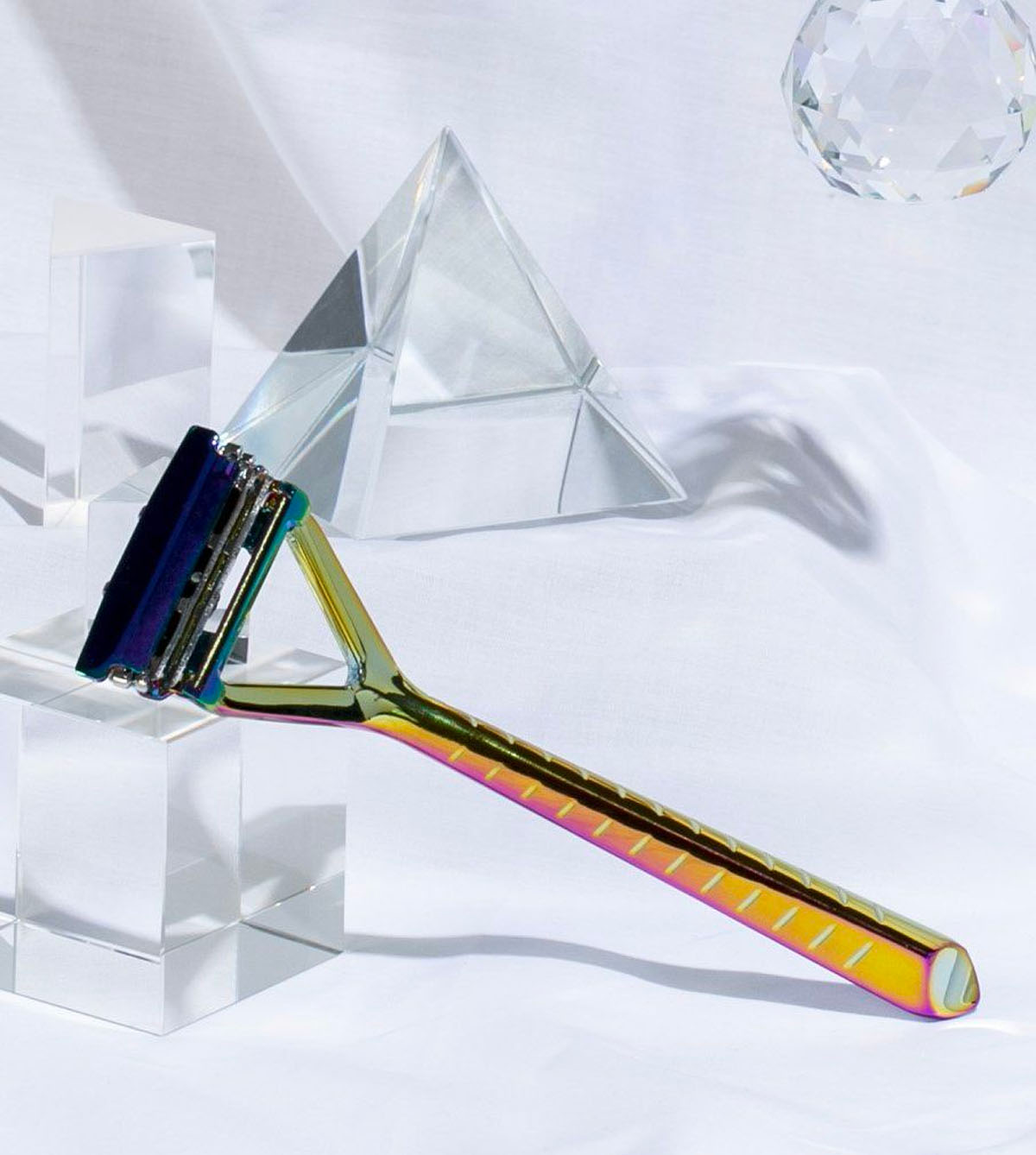 PRISM LEAF RAZOR POSED AMONGST PRISMS ON A WHITE BACKDROP