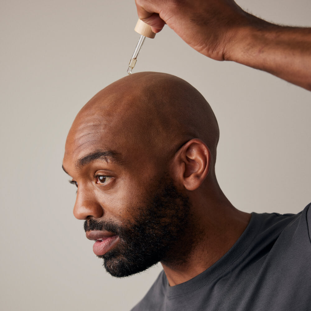 Man drops calming serum on his head