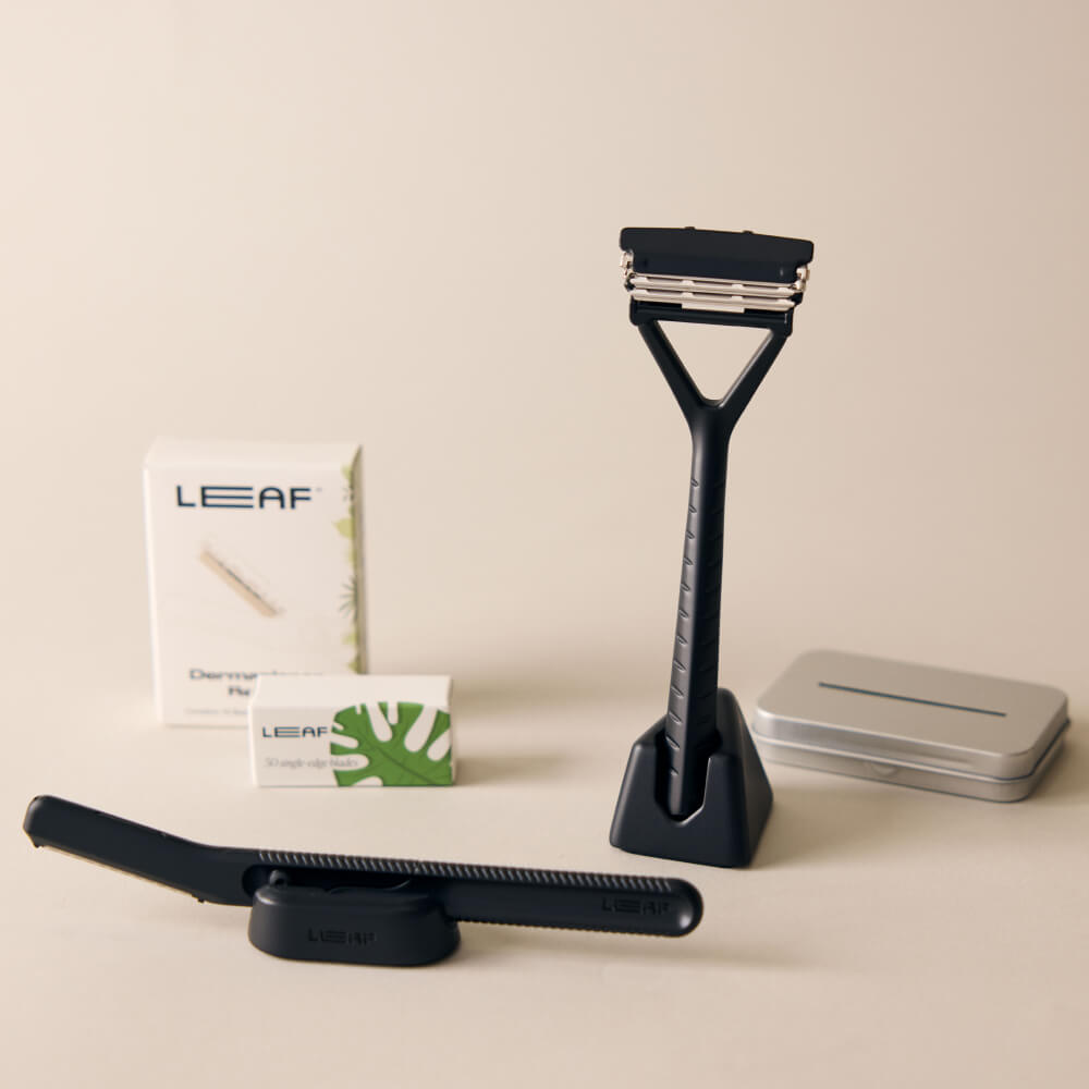 The black face and body set kit with the Leaf razor, dermaplaner, blade refills and stands for each, each the recycling tin