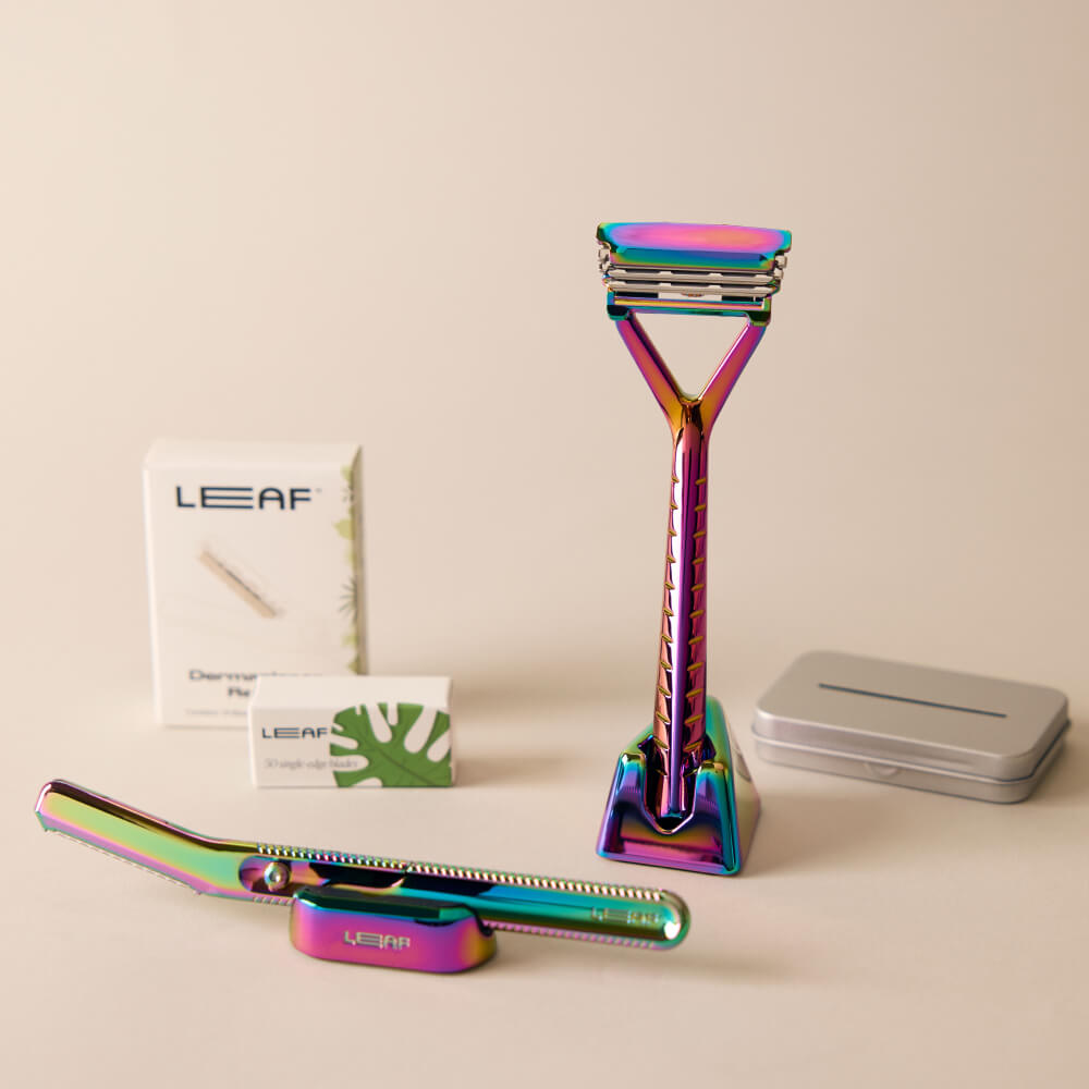 The prism face and body set kit with the leaf razor, dermaplaner, blade refills and stands for each, and recycling tin