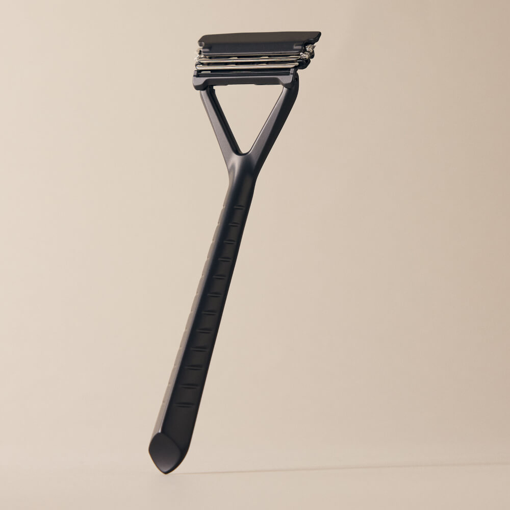 Leaf razor displayed upright in black