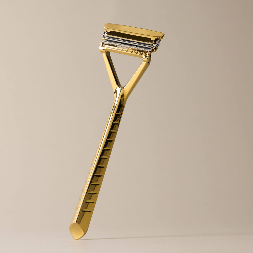 Leaf razor displayed upright in gold