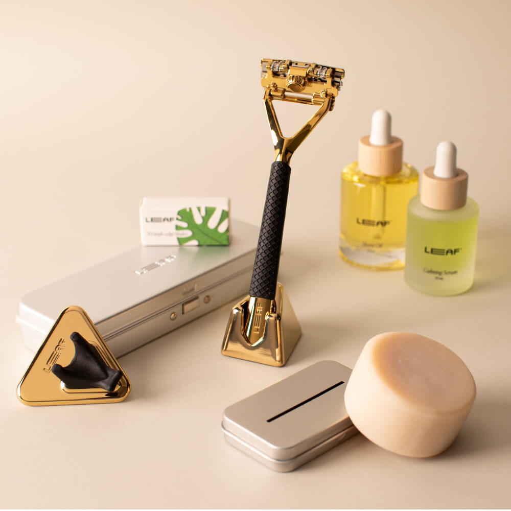 Gold leaf everything bundle with Leaf razor, blades, case, recycling tin, calming serum, shave oil, shower holder, and shave soap bar