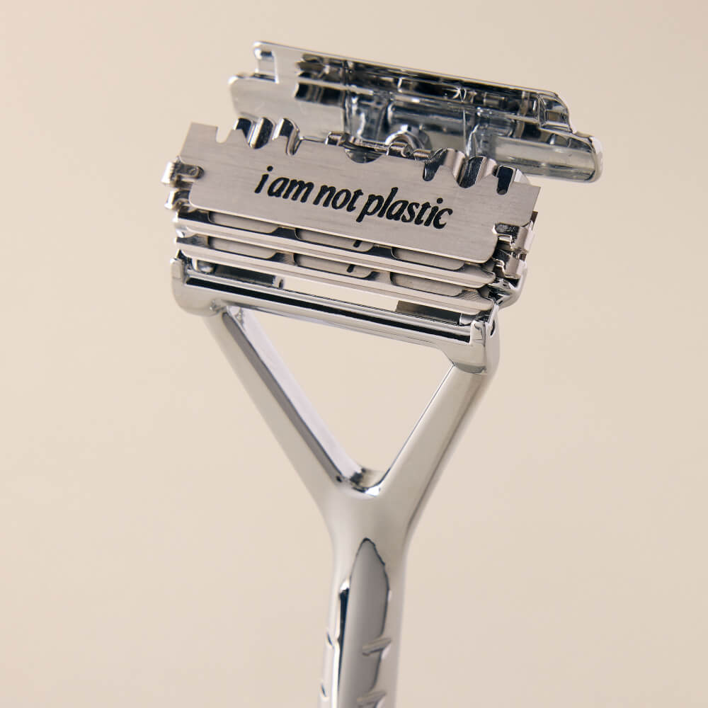 Closeup of the Leaf razor handle open to display the blades