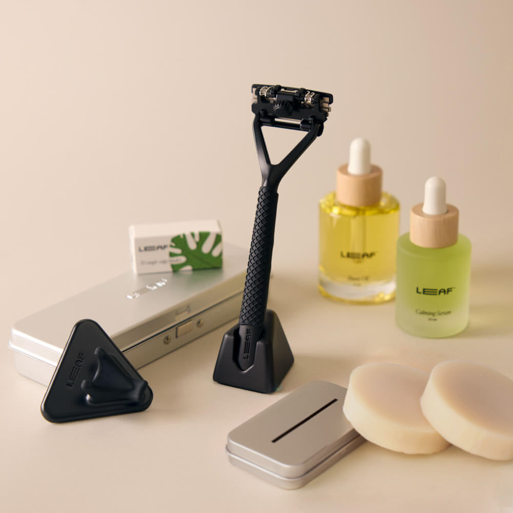 Black leaf everything bundle with Leaf razor, stand, blades, case, recycling tin, calming serum, shave oil, shower holder, grip, and shave soap bar