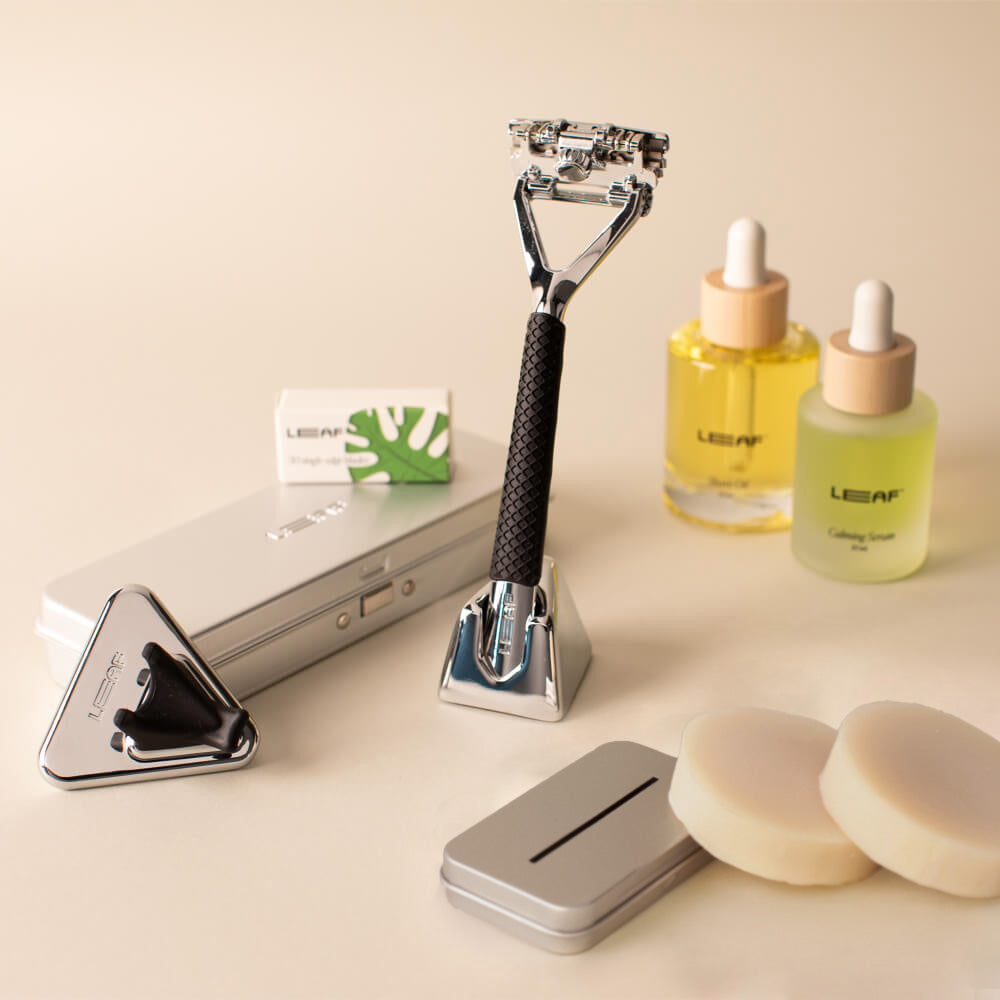 Chrome leaf everything bundle with Leaf razor, stand, blades, case, recycling tin, calming serum, shave oil, shower holder, grip, and shave soap bar