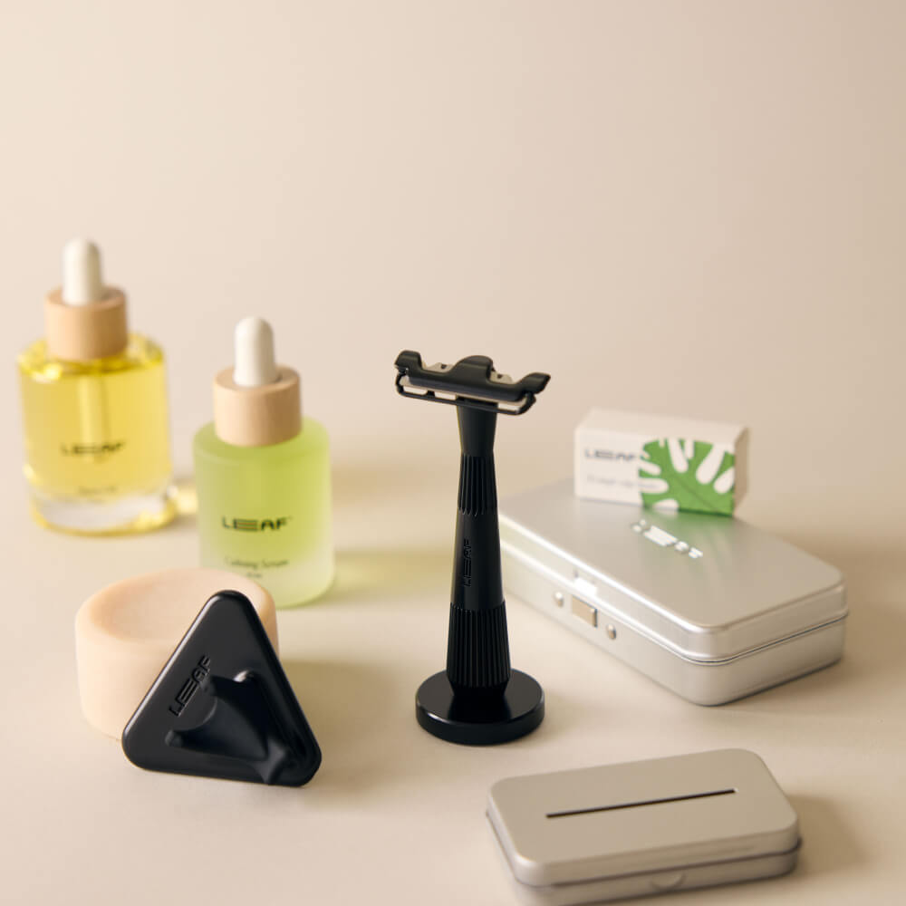 The black single edge everything bundle with the single edge razor, stand, case, recycling tin, shave oil, calming serum, soap bar, and shower holder 