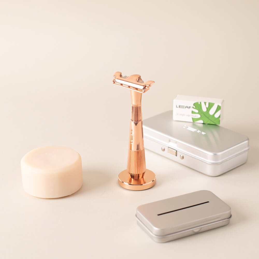 A rose gold single edge super bundle with a razor, 50 pack of blades, recycling tin, razor case, and soap bar